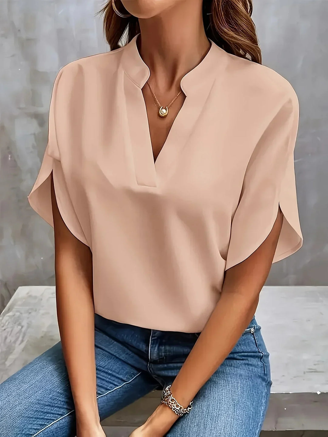 Modern women's fashion blouse: short sleeve, V-neck, loose fit. An easy-to-wear casual and elegant top for women.