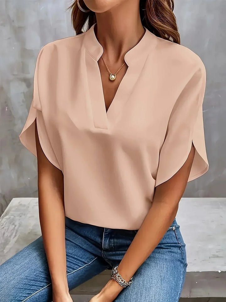 Modern women's fashion blouse: short sleeve, V-neck, loose fit. An easy-to-wear casual and elegant top for women.