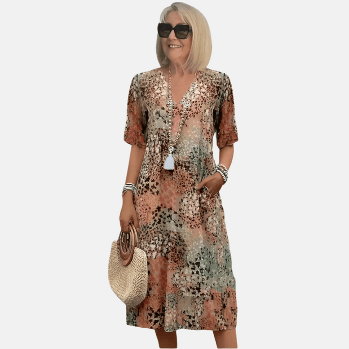 Women's loose fit summer casual V-neck sundress with short sleeves & vibrant print, perfect for effortless vacation wear.