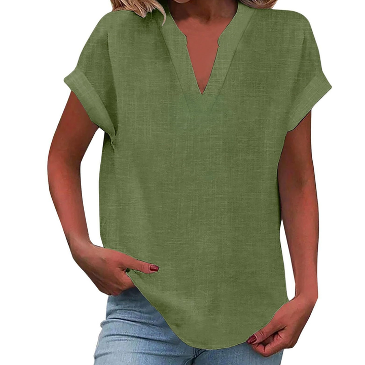 Modern loose fit V-neck women's blouse, a stylish short sleeve top for contemporary summer casual wear.