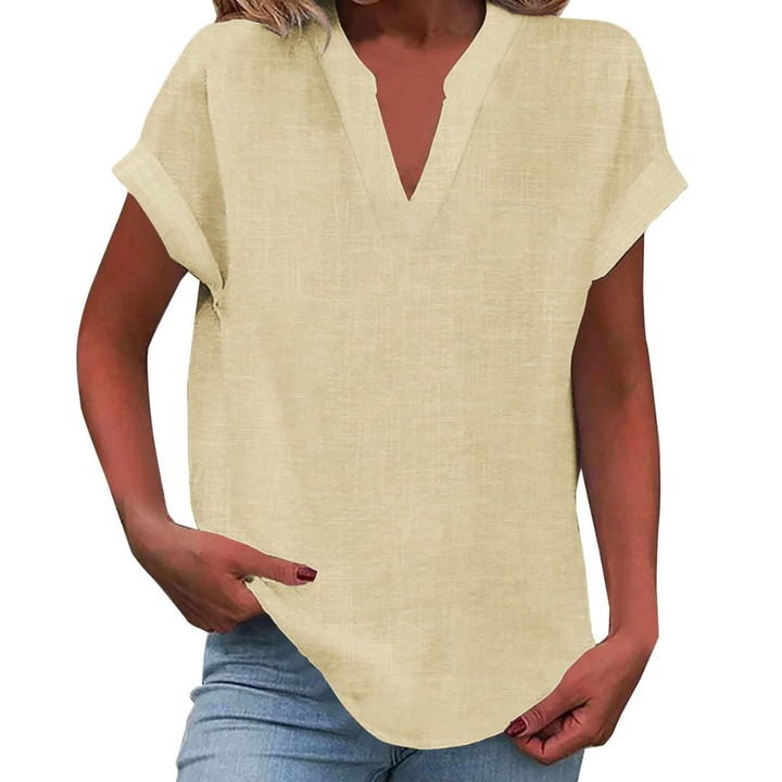 Versatile women's short sleeve V-neck blouse, offering easy comfort and casual summer fashion. Loose fit.