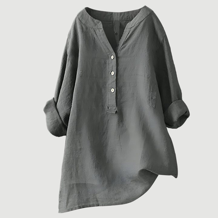Stylish plus size women's blouse, a versatile loose fit top with V-neck for effortless comfort.