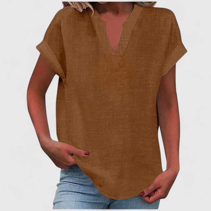 Women's loose fit V-neck casual blouse with cap sleeves & curved hem. Perfect for everyday wear.