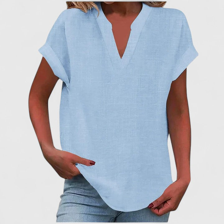 Women's loose fit V-neck casual blouse, with cap sleeves and a chic curved hemline.