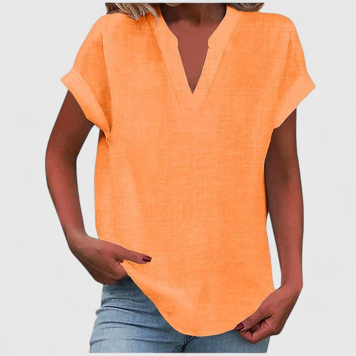Comfortable women's V-neck top, relaxed loose fit, cap sleeves, versatile for casual occasions.
