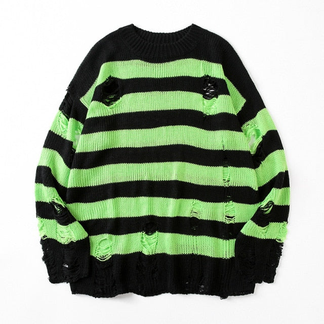 Trendy women's oversized striped sweater with a stylish ripped design, offering effortless casual fashion and comfort.