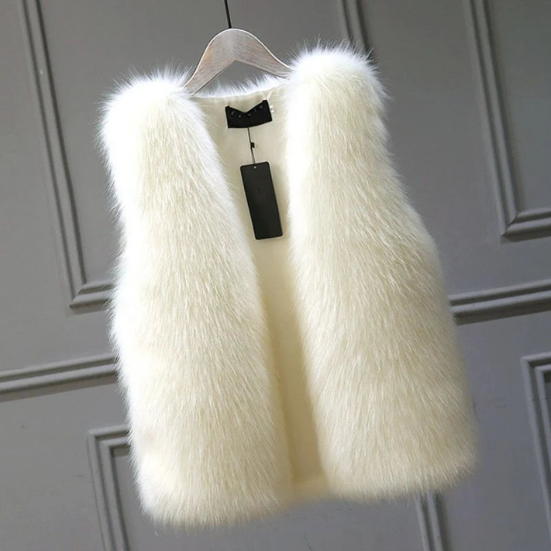 Women's luxurious warm winter vest, elegant sleeveless jacket for cozy layering & chic fall fashion.