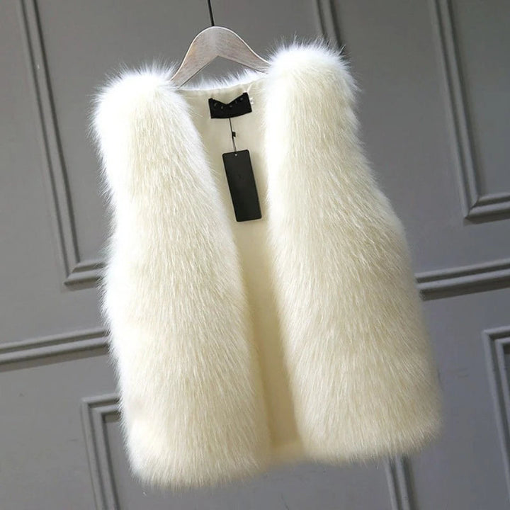 Women's luxurious warm winter vest, elegant sleeveless jacket for cozy layering & chic fall fashion.