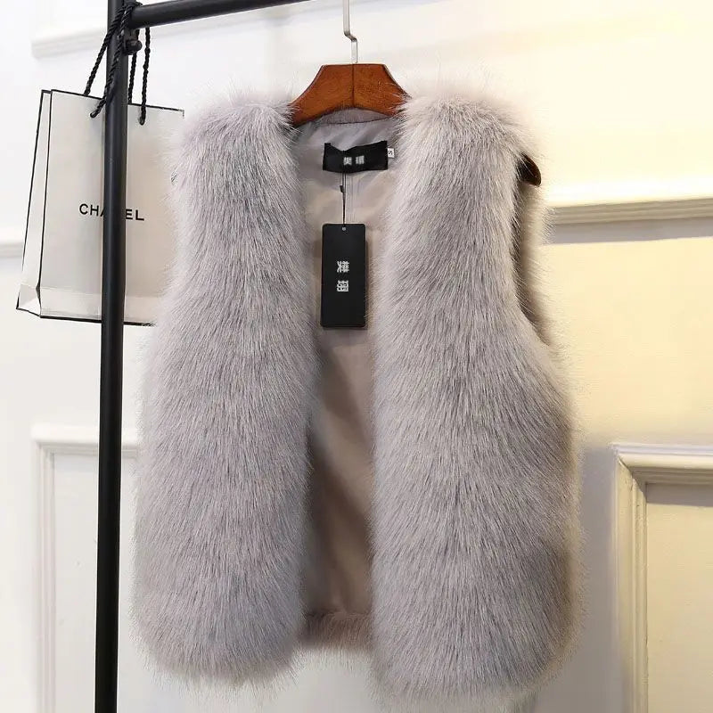 Premium women's warm winter vest. Cozy & elegant sleeveless jacket, perfect for luxurious fall & winter fashion.