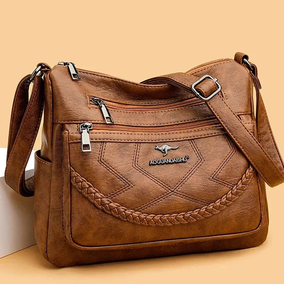 Versatile women's soft leather cross body & shoulder bag with adjustable strap.