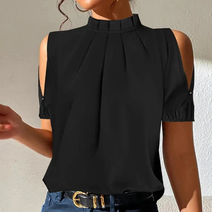 Stylish women's black pleated Lynette top featuring chic flared sleeves. A comfortable and versatile piece for any occasion.