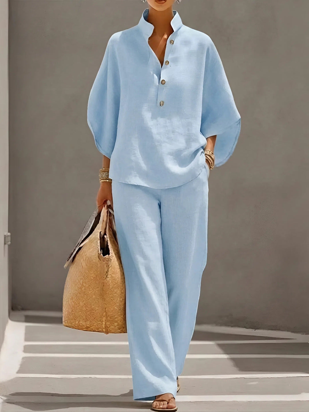 Stylish women's two-piece outfit with mandarin collar & flowy kimono sleeves, great for resort wear.