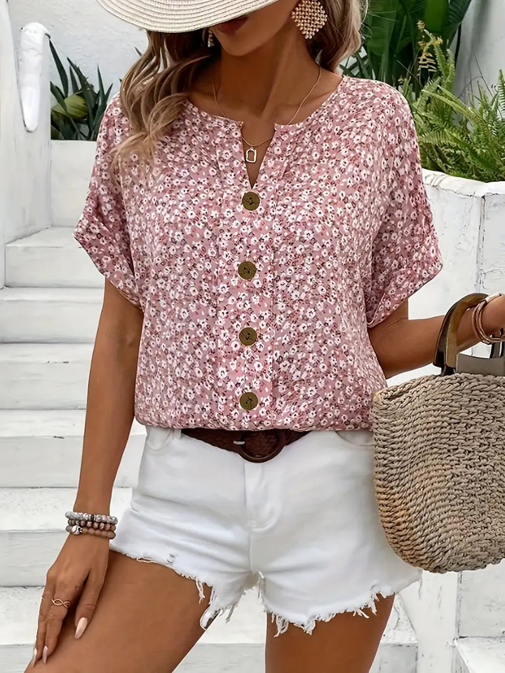 Women's Maren blouse with delicate floral print, loose fit, and long sleeves. Elegant and comfortable button-up top.