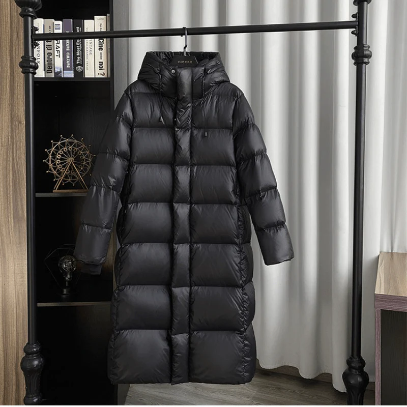 Cozy women's hooded maxi quilted winter jacket, ideal for cold weather protection & sleek style.