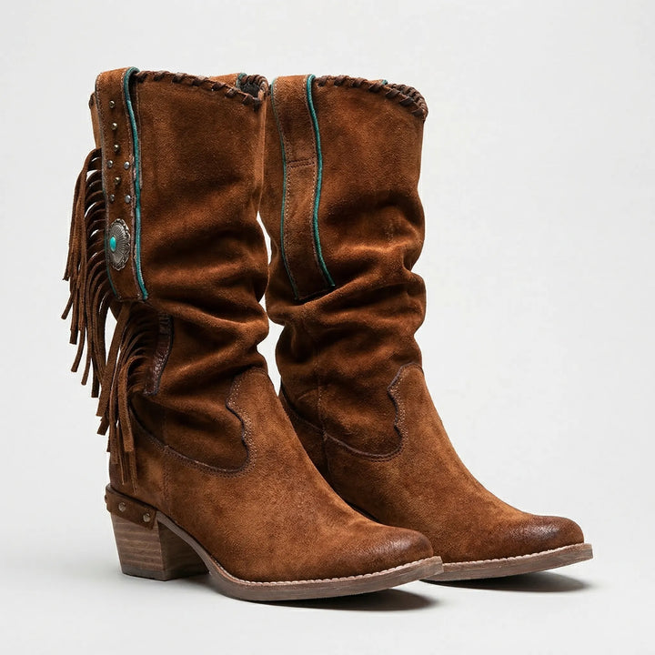 Authentic women's western mid-calf boots with playful fringe. Cowgirl style, pointed toe, and block heel.