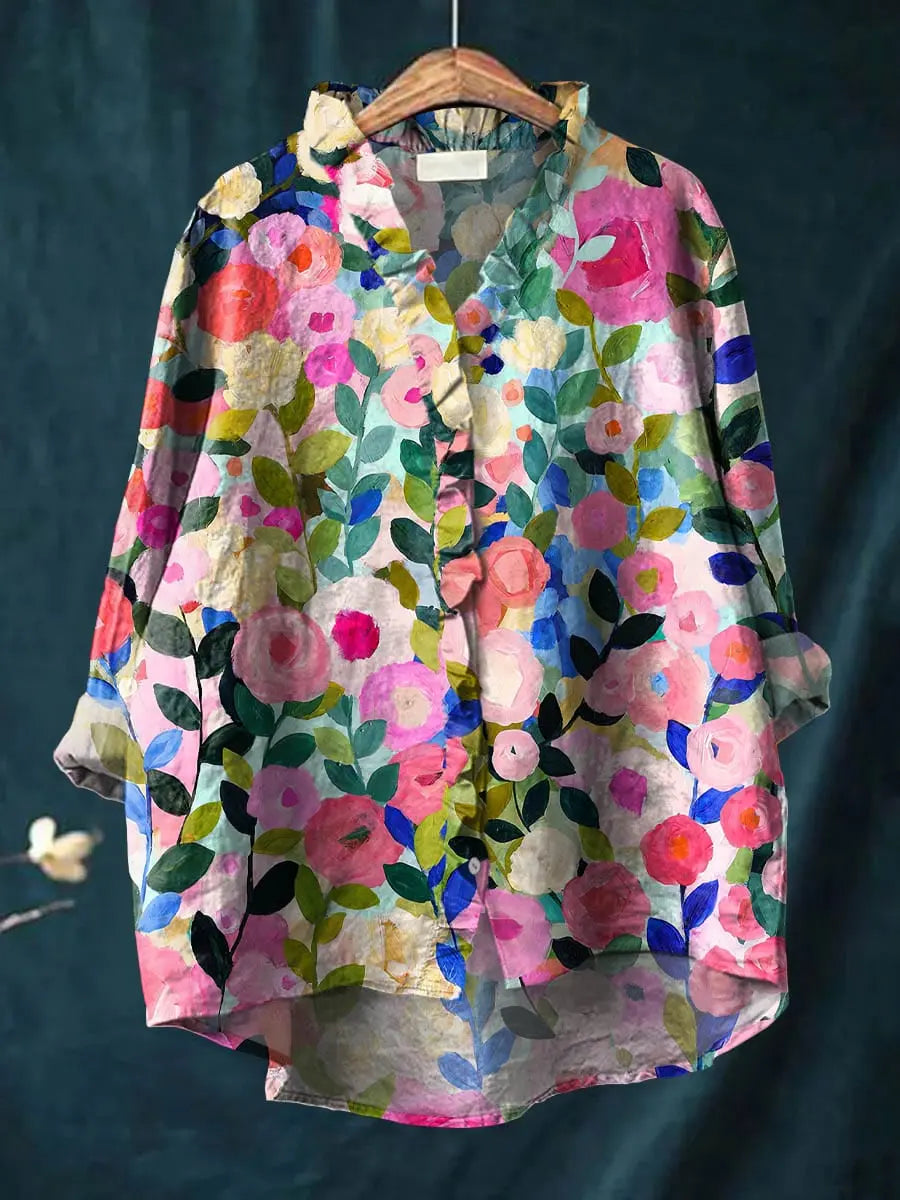 Women's Mirelle floral print ruffle blouse. Elegant long sleeve flowy top for summer & casual wear.