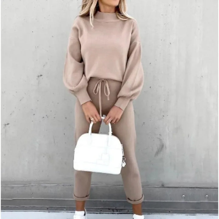 Cozy women's two-piece set, perfect for lounging. Features a mock neck, drawstring, and stylish balloon sleeves.