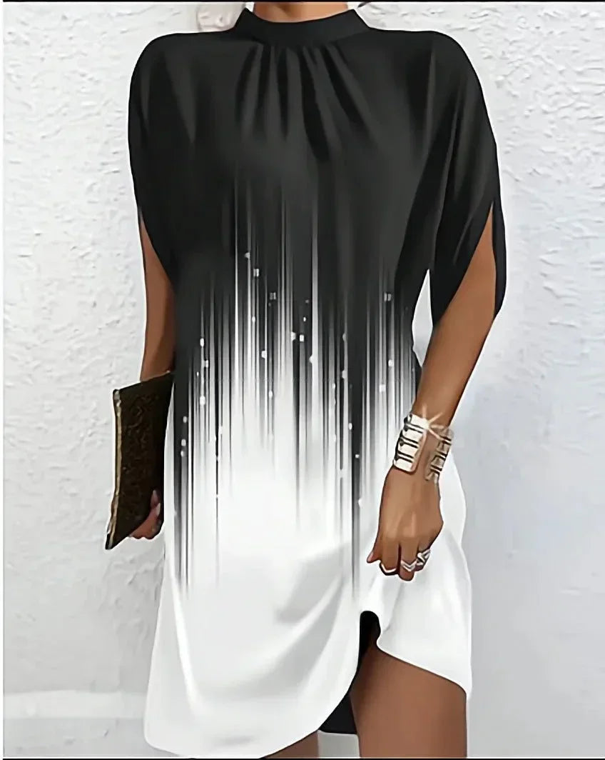 Designer women's mini dress with a stylish mock neck, unique split cape sleeves & asymmetric hem.