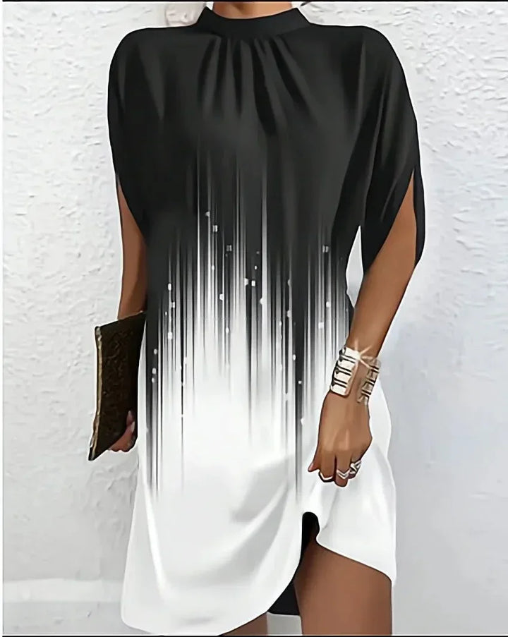 Designer women's mini dress with a stylish mock neck, unique split cape sleeves & asymmetric hem.