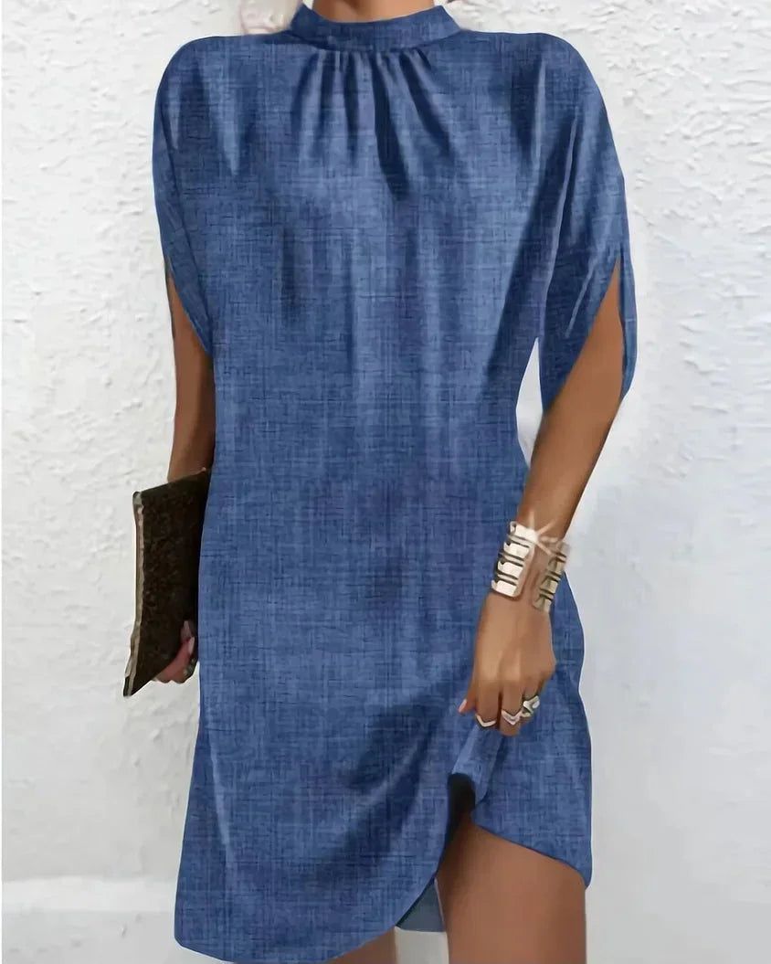 Sleek & elegant women's mock neck mini dress with sophisticated cape split sleeves, perfect for parties.