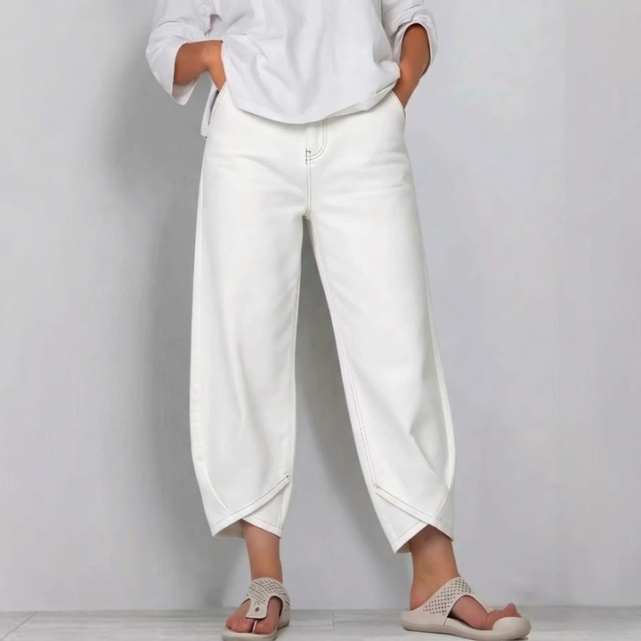 Modern women's cropped denim jeans with a stylish barrel leg, enhancing any fashion-forward look.