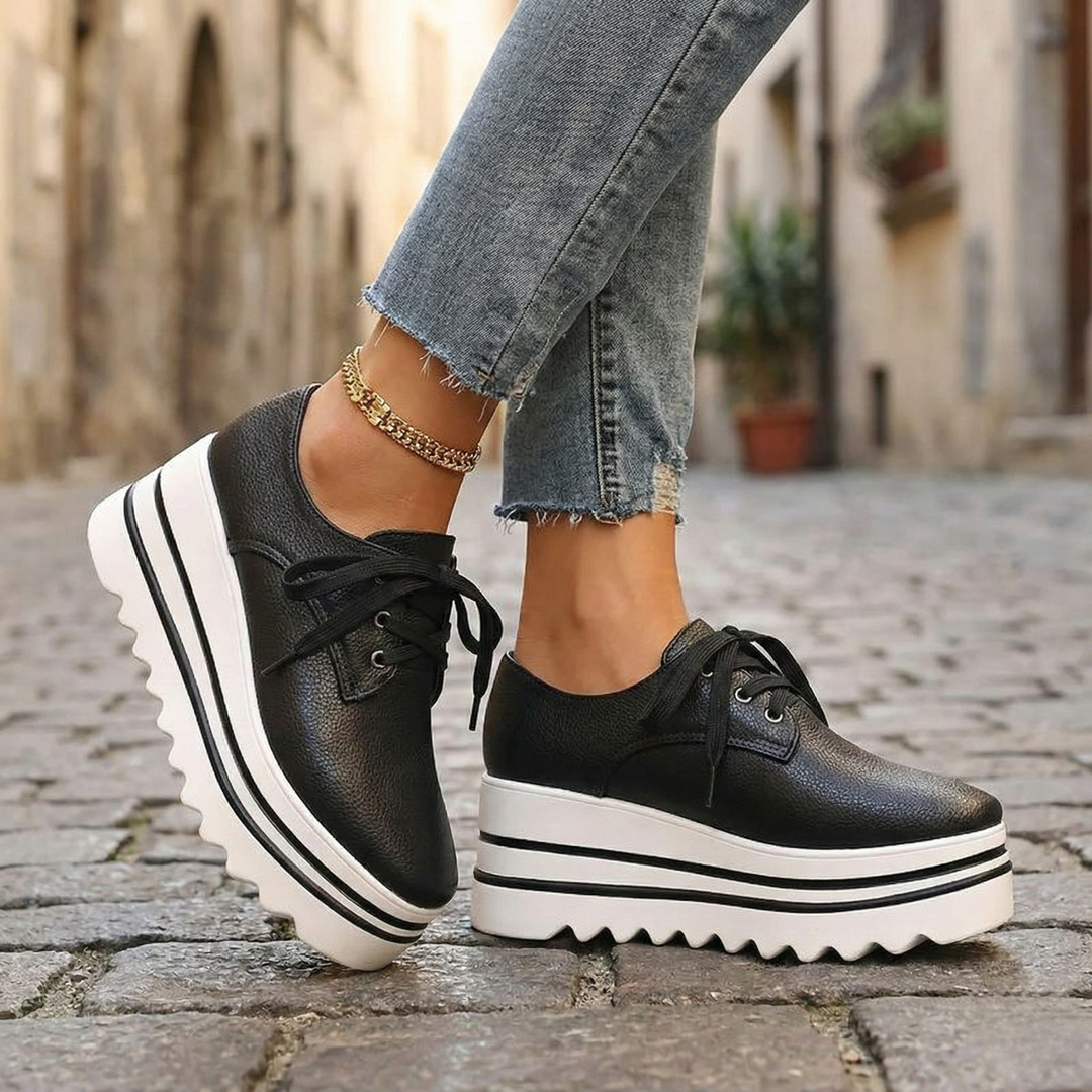 Women's modern black platform Oxford shoes with lace-up closure for elevated style and comfort.