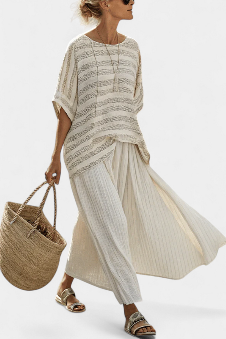 Women's multi-colored striped batwing top and flowy maxi skirt two-piece set, perfect for summer vacation or coastal style.