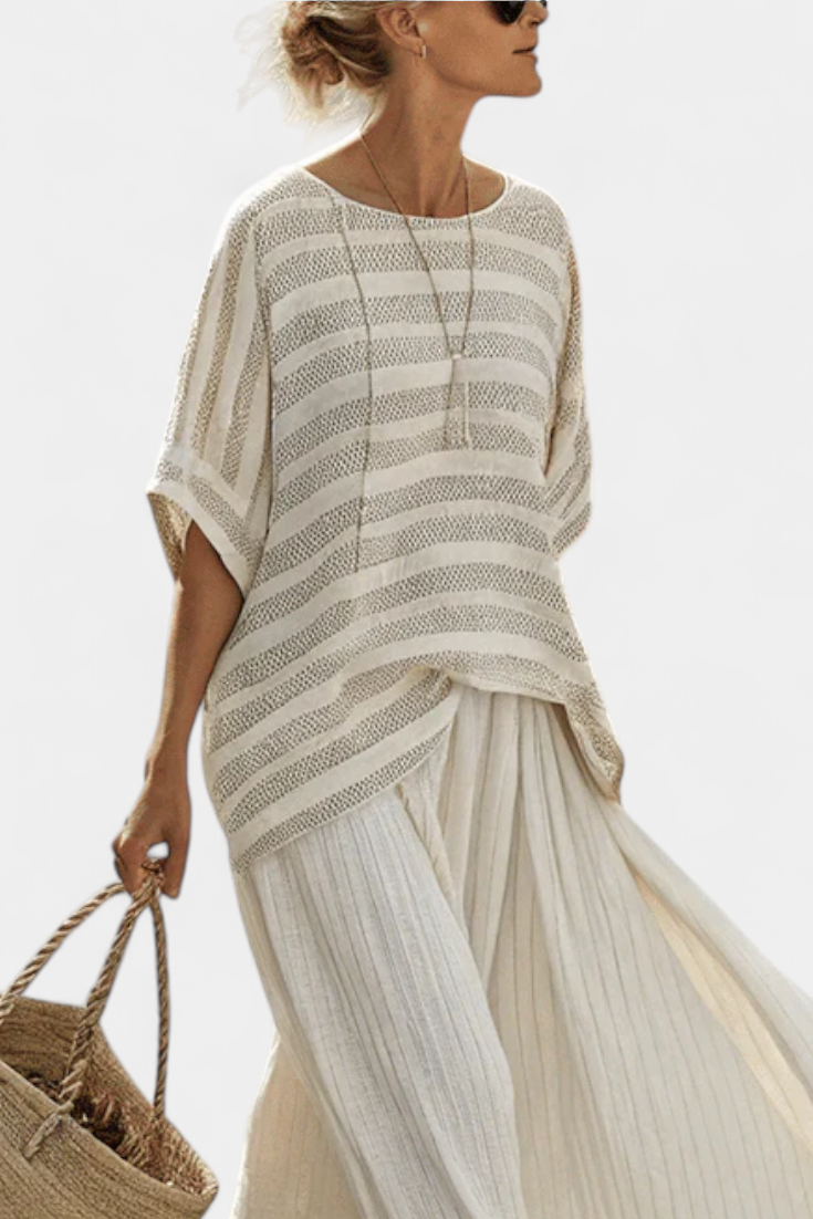 Elegant women's striped batwing top & flowy maxi skirt set in multi-colors, ideal for casual summer or vacation wear.