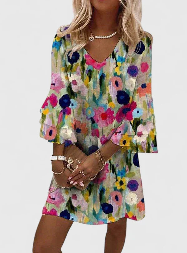 Women's multicolor floral V-neck mini dress with ruffled sleeves, perfect for summer casual or vacation wear.