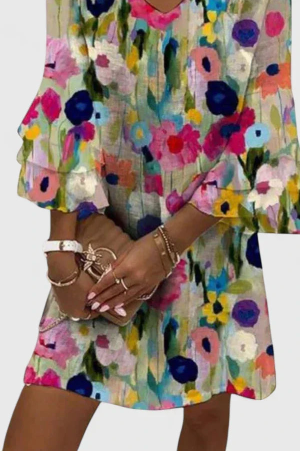 Stylish women's summer floral mini dress featuring a comfortable V-neck design and playful ruffled short sleeves.