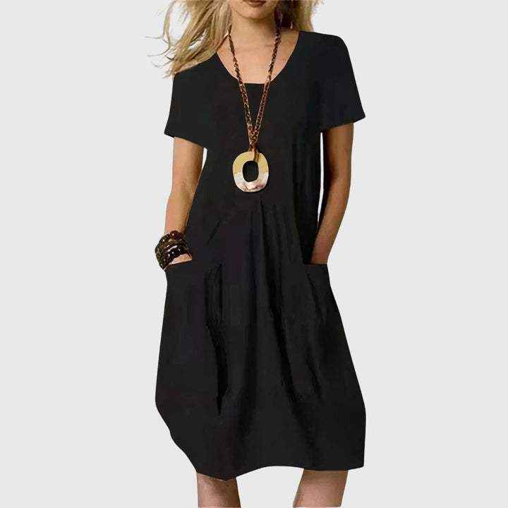 Chic orange Naomi casual A-line dress for women, featuring practical pockets and comfortable fabric for summer style.