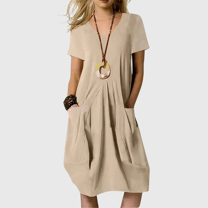 Comfortable green Naomi A-line casual dress, perfect for women seeking effortless everyday style and summer comfort with pockets.