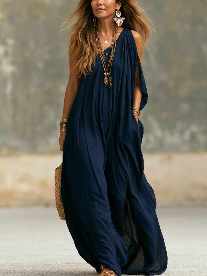 Women's navy one-shoulder wide-leg jumpsuit, bohemian style, perfect for summer resort wear.