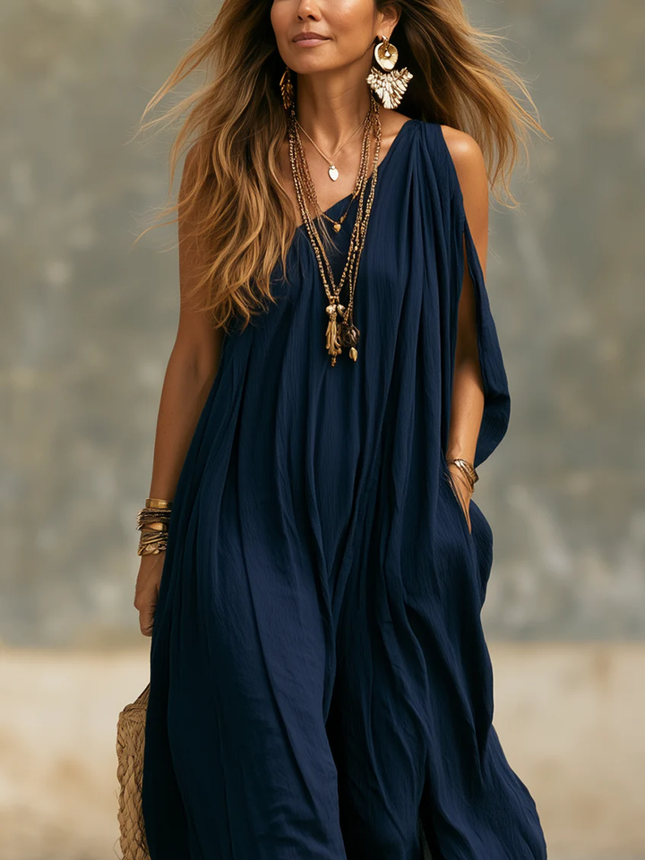 Flowy navy bohemian one-shoulder wide-leg jumpsuit for women, comfortable summer evening wear.