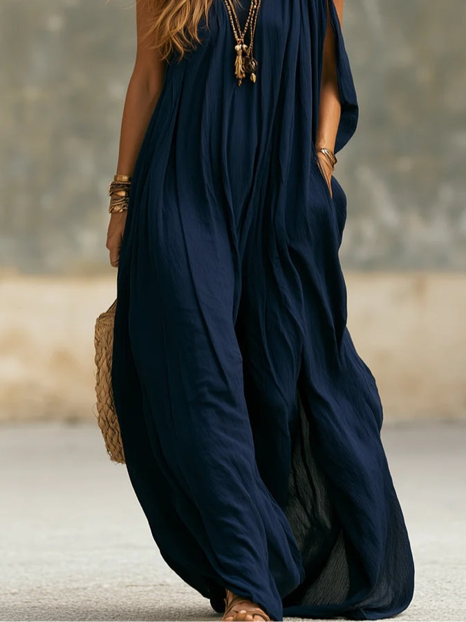Elegant women's navy one-shoulder wide-leg jumpsuit, maxi style, ideal for resort or evening wear.