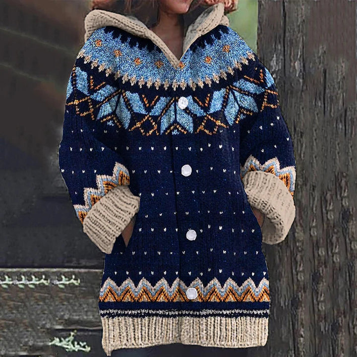 Relaxed fit women's knit cardigan, hooded, with intricate Nordic pattern, perfect for autumn layering.