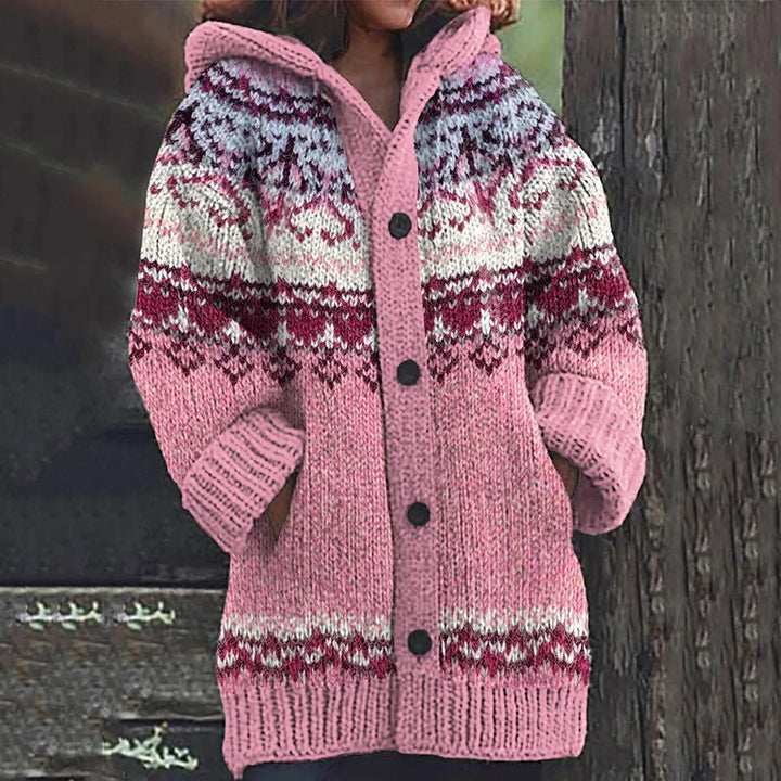 Warm women's Nordic knit cardigan with hood, featuring classic Fair Isle pattern & button closure for winter.