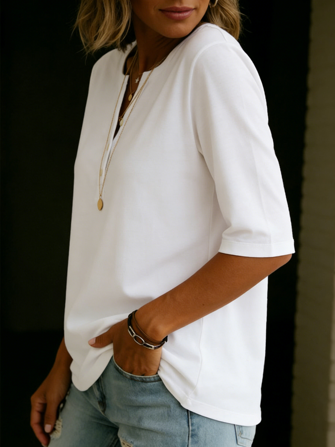 Effortless women's blouse: 3/4 sleeve, notch neck, relaxed fit for work or casual style.