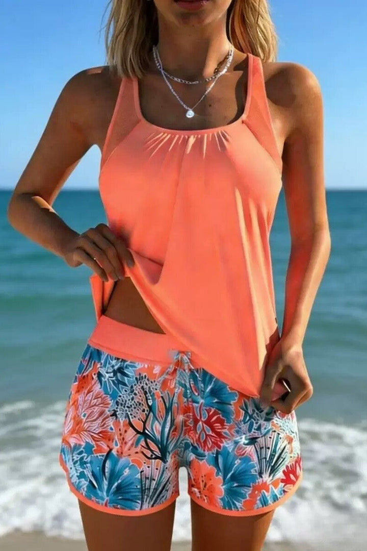 Flattering women's tankini set featuring an Ocean Breeze marine print and tummy control for stylish swim comfort.