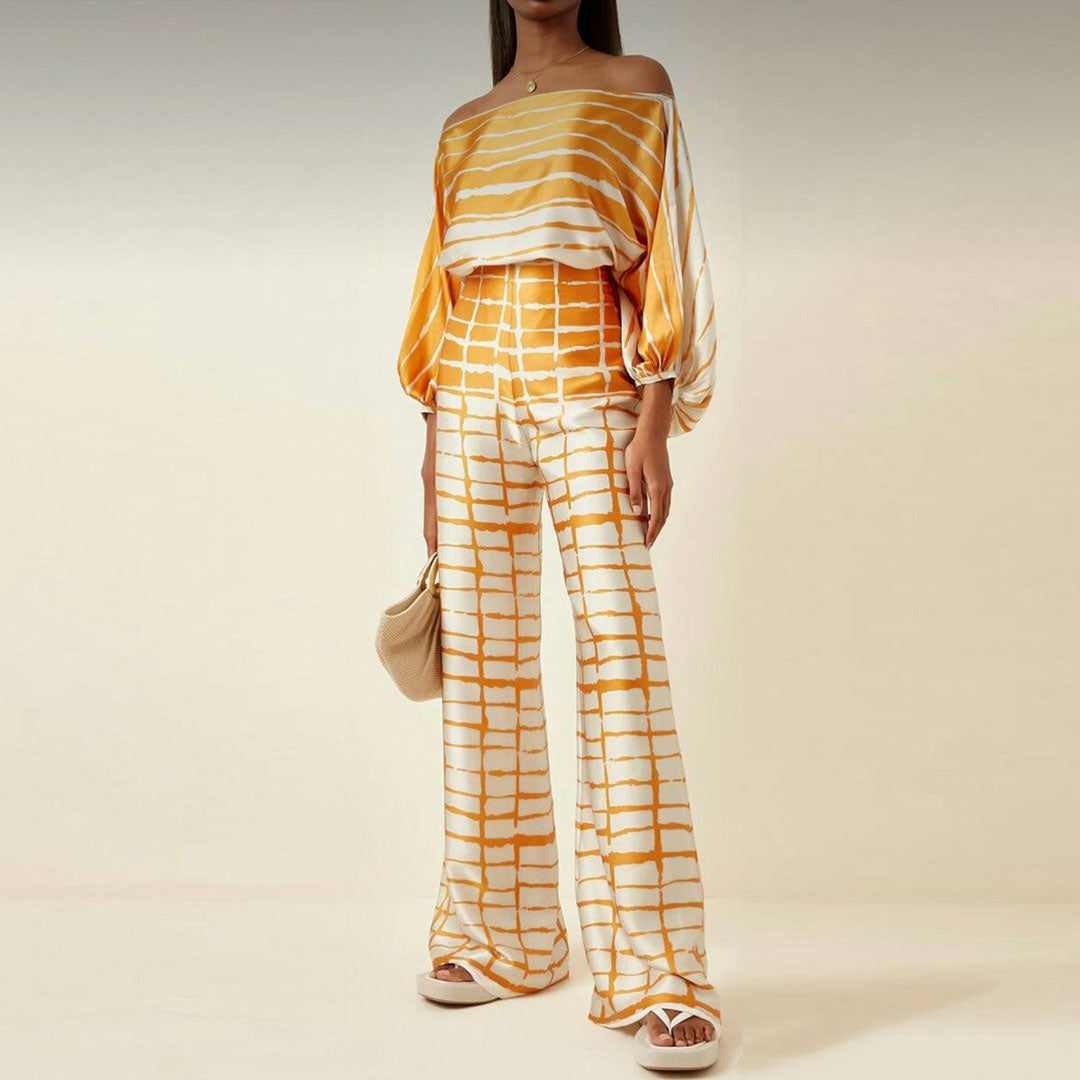 Chic women's off-shoulder printed two-piece set, combining casual comfort with trendy summer style.