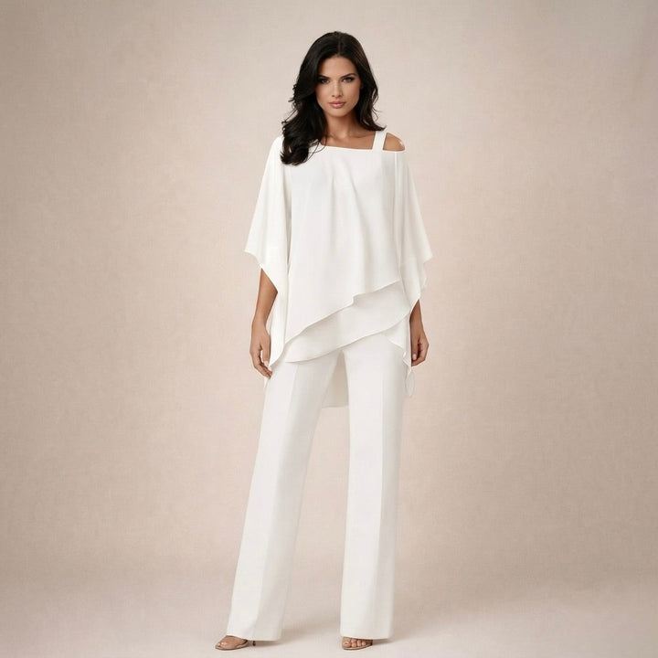 Women's off-shoulder top and wide-leg pants matching set. Elegant two-piece summer outfit.