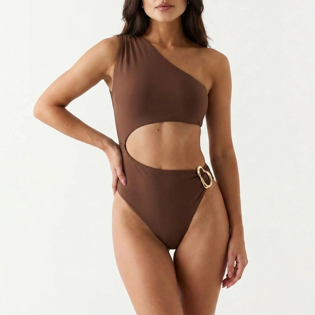 Elegant women's one-shoulder cut-out monokini for resort wear. Bold and trendy vacation beach fashion.