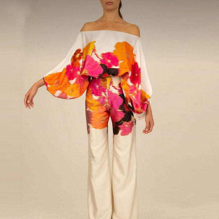 Chic women's printed co-ord set, one-shoulder top & relaxed wide-leg pants for statement summer fashion.