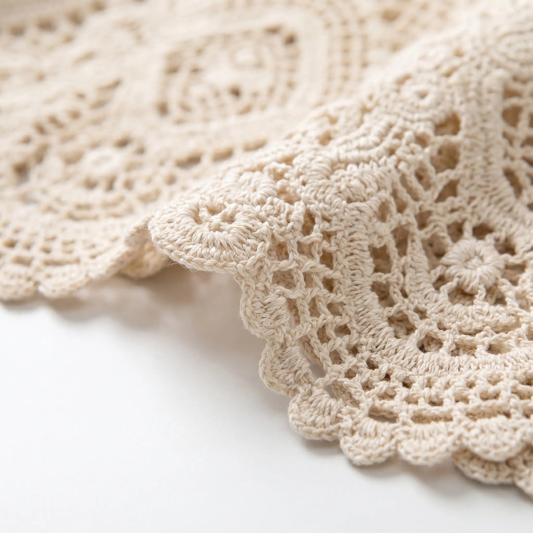 Lightweight women's crochet-style cardigan with open front, great for casual summer outfits.