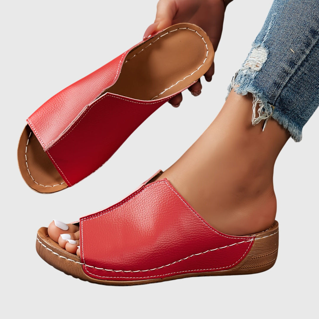 Comfortable women's ergonomic open-toe flat sandals, stylish summer shoes for everyday wear.