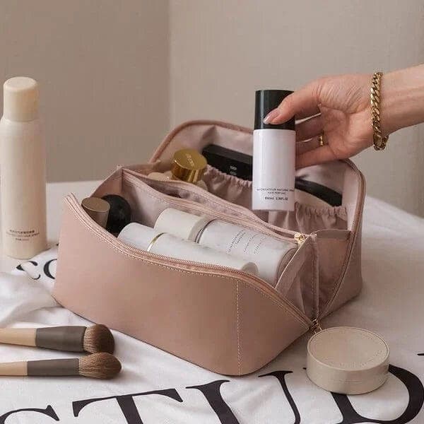 Women's organized cosmetic bag with multiple compartments for makeup & toiletries. Ideal travel beauty storage.