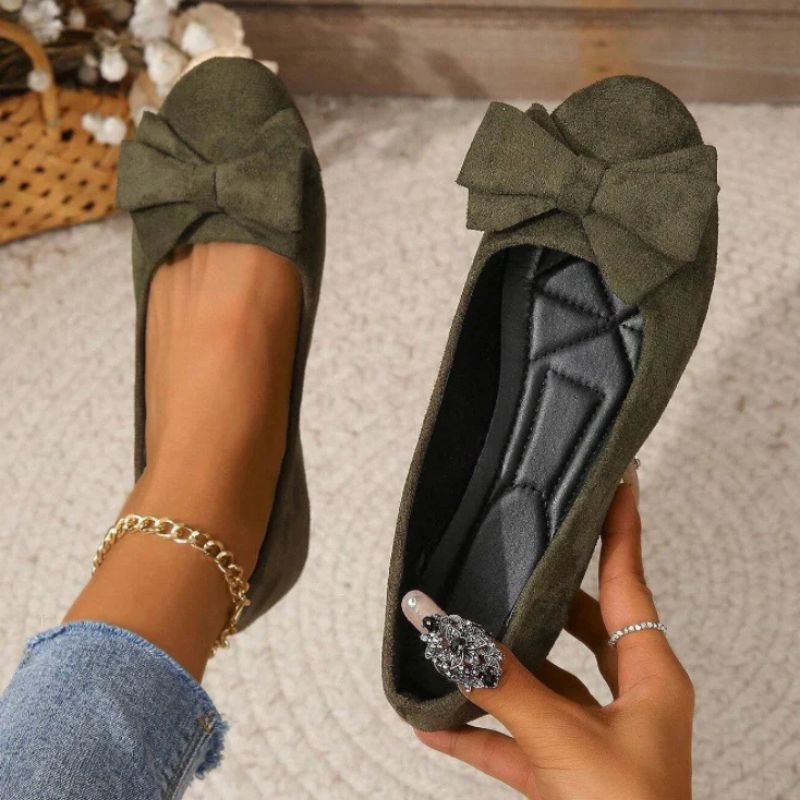 Black wide fit ballet flats for women, offering orthopaedic support for all-day comfort.
