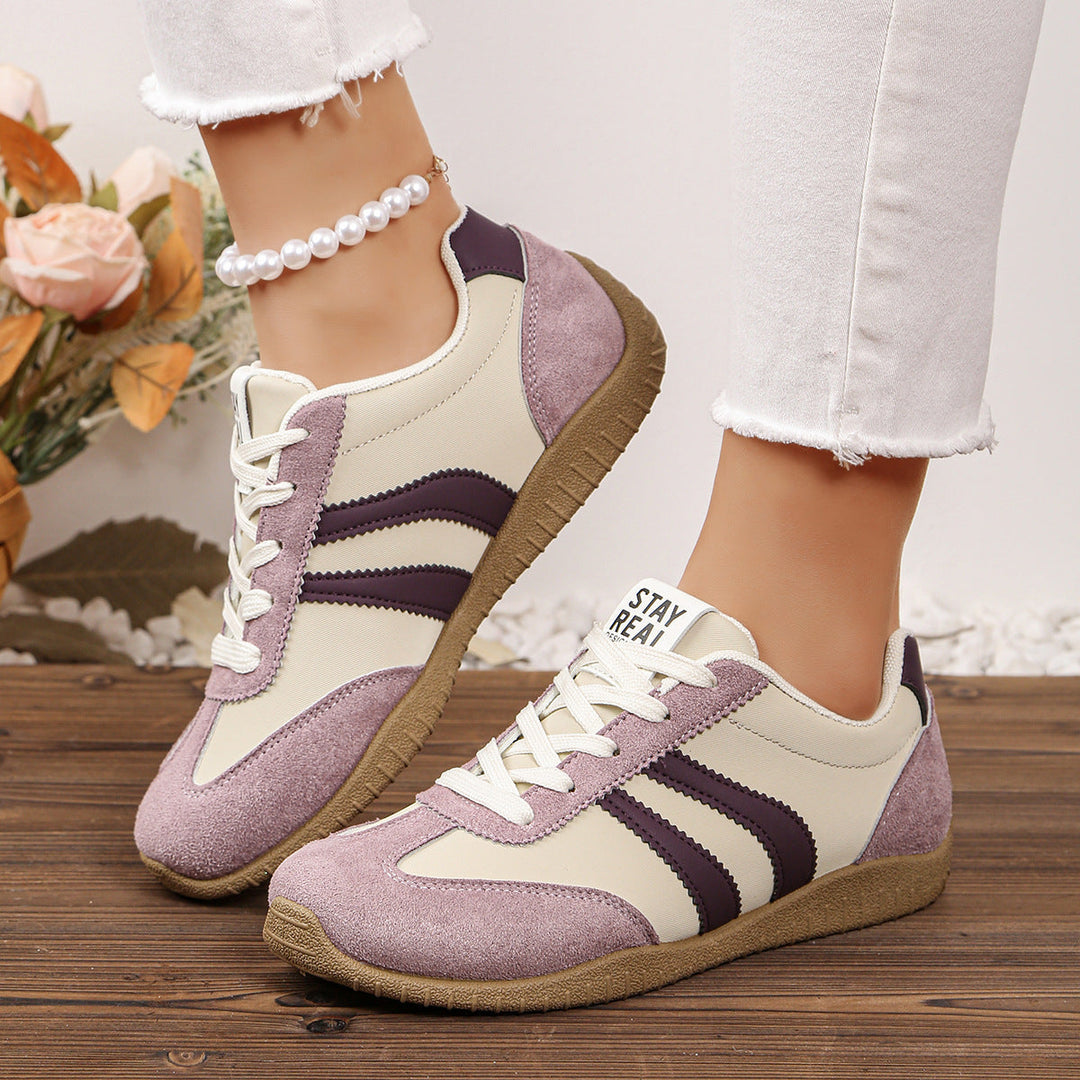 Women's supportive footwear, wide fit, engineered with arch support for stability.