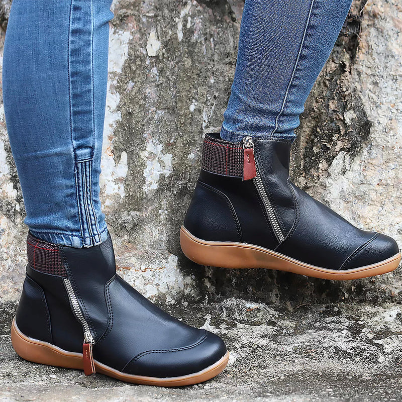 Stylish women's black orthopedic ankle boots, perfect for fall/winter comfort & support.