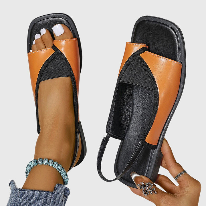 Stylish women's open-toe beach sandals, cushioned for summer comfort & casual wear by the sea.